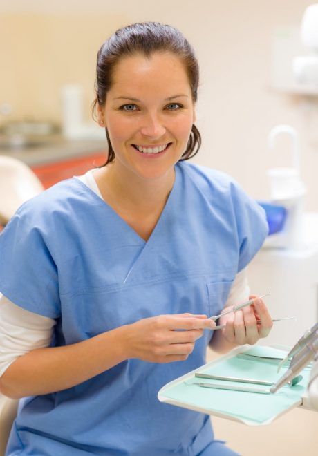 young female dental assistant working